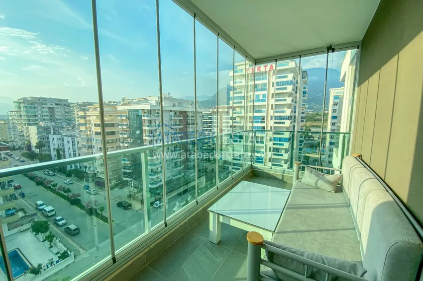 Приобрести Квартира в Махмутларе с новой мебелью и застекленным балконом в комплексе комфорт-класса 18 