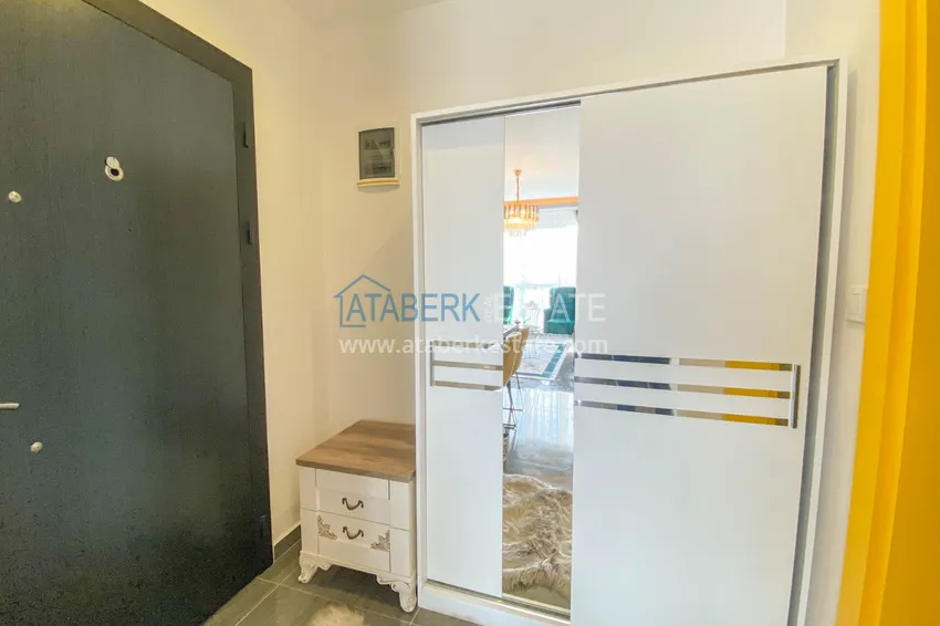 Приобрести Квартира в Махмутларе с новой мебелью и застекленным балконом в комплексе комфорт-класса 1 