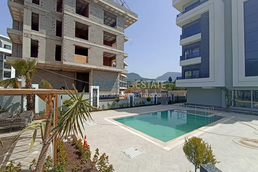 Квартира в Алании район Оба с чистовой отделкой в новостройке 5 