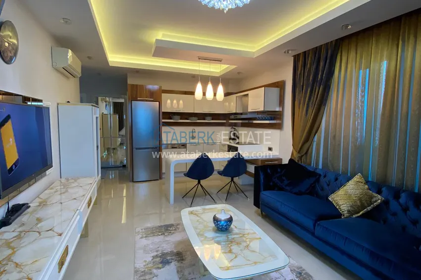 Приобрести Квартира в Махмутларе меблированная с застекленным балконом и открытым видом на море 1 