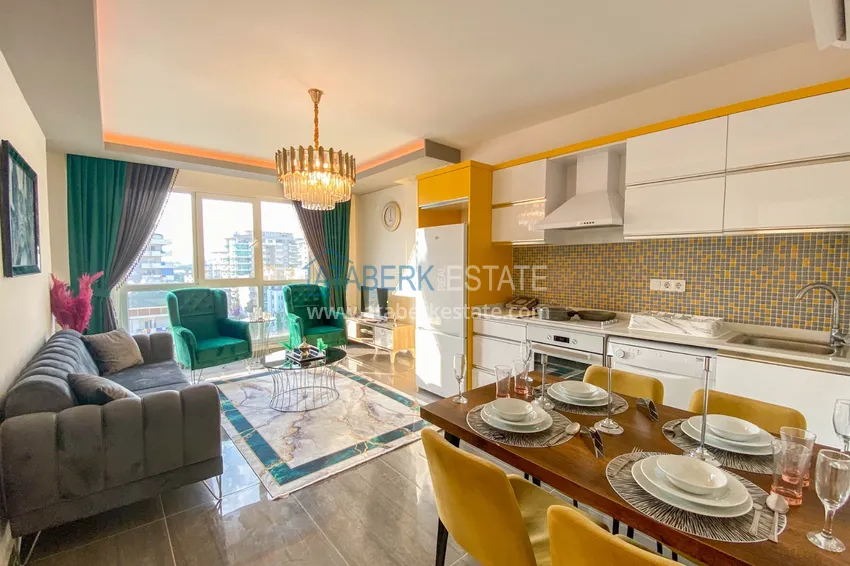 Приобрести Квартира в Махмутларе с новой мебелью и застекленным балконом в комплексе комфорт-класса 2 