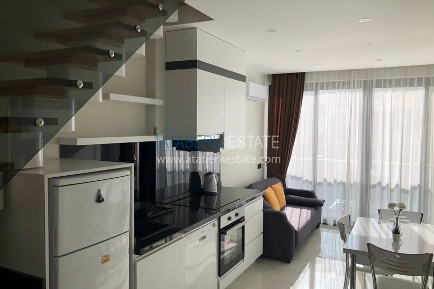 Приобрести Дуплекс в Махмутларе с боковым видом на море на первой береговой линии 2 