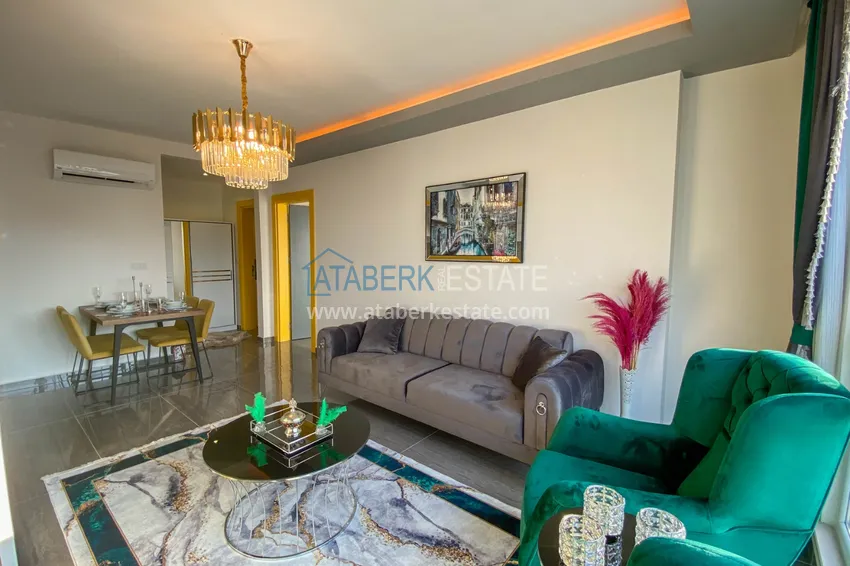 Приобрести Квартира в Махмутларе с новой мебелью и застекленным балконом в комплексе комфорт-класса 3 