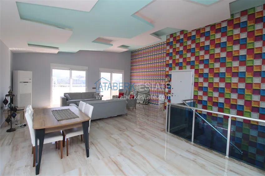 Приобрести Пентхаус в Махмутларе с мебелью, сауной и видом на море и горы 3