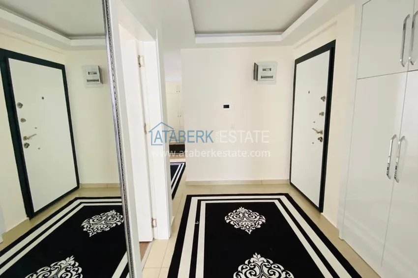 Приобрести Квартира в Махмутларе меблированная с отдельной кухней и видом на горы располагает собственной охраняемой территорией с инфраструктурой 3 