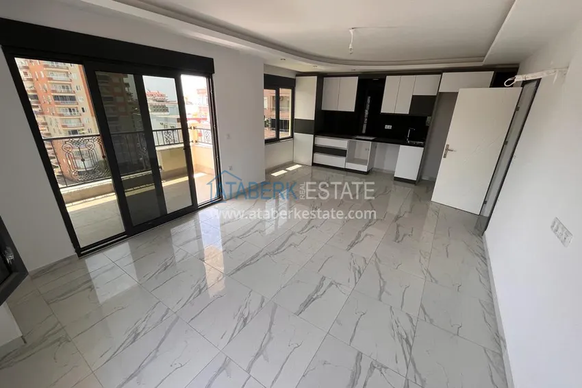 Приобрести Квартира в Махмутларе с видом на горы в современном жилом комплексе 3 