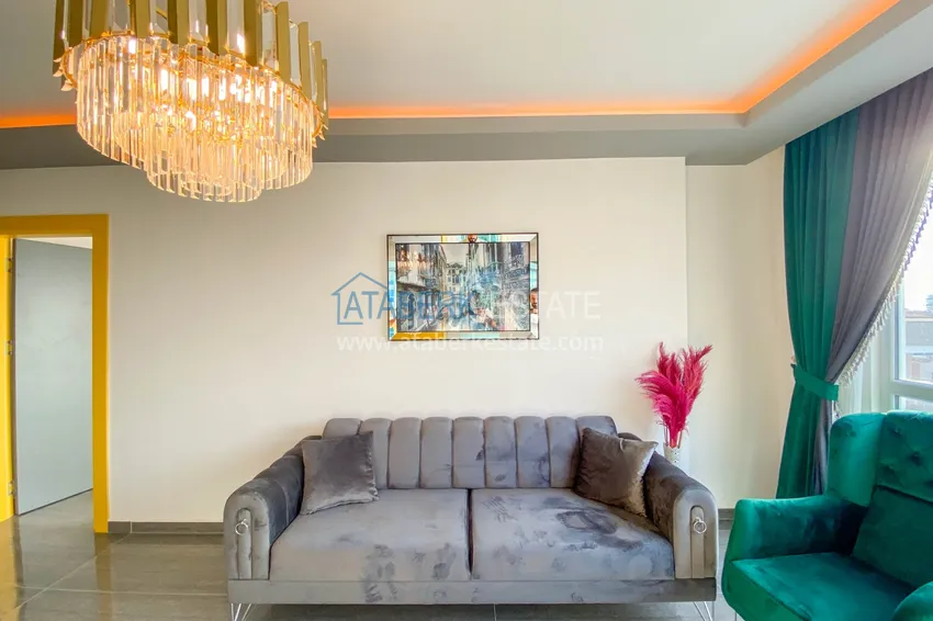 Приобрести Квартира в Махмутларе с новой мебелью и застекленным балконом в комплексе комфорт-класса 4 