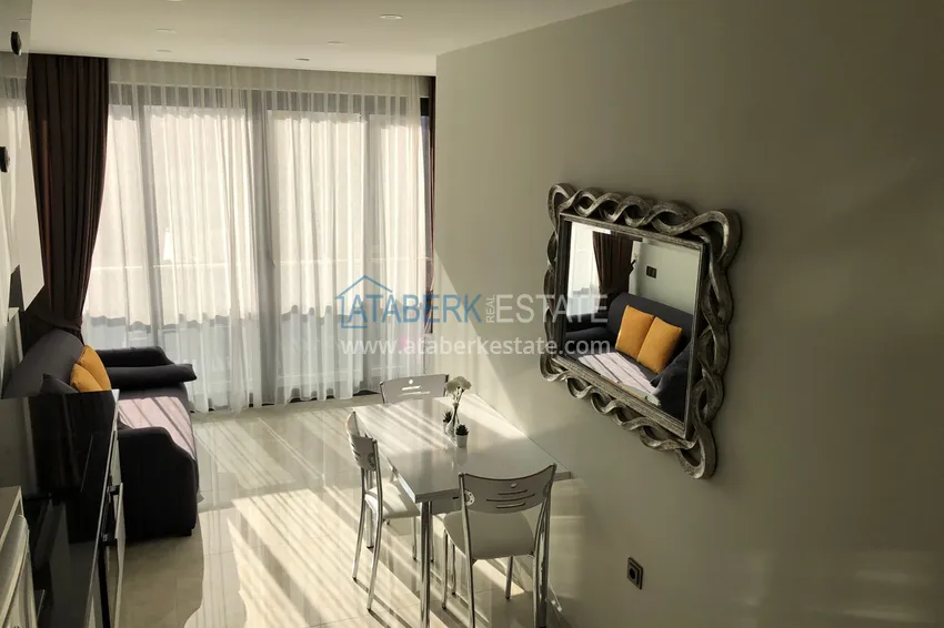 Приобрести Дуплекс в Махмутларе с боковым видом на море на первой береговой линии 4 