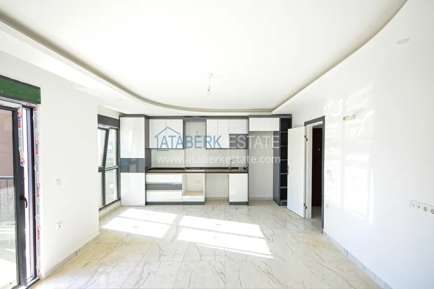 Приобрести Квартира в Махмутларе с видом на горы в современном жилом комплексе 4 