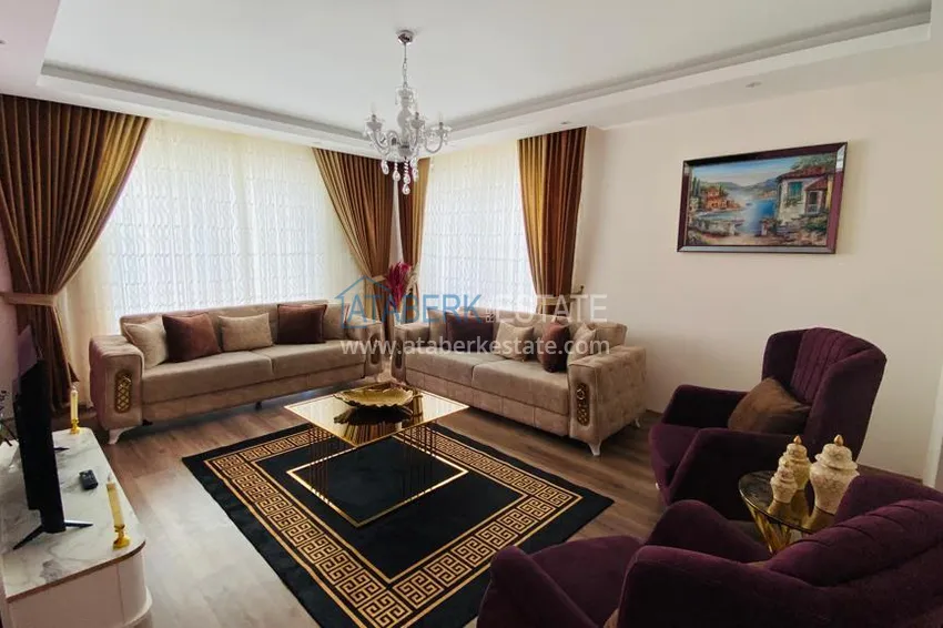 Приобрести Квартира в Махмутларе меблированная с отдельной кухней и видом на горы располагает собственной охраняемой территорией с инфраструктурой 7 