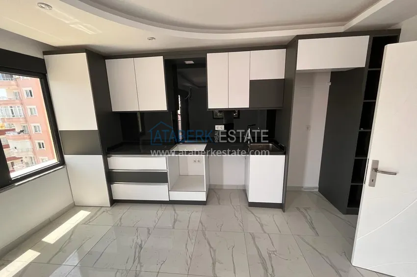 Приобрести Квартира в Махмутларе с видом на горы в современном жилом комплексе 5 