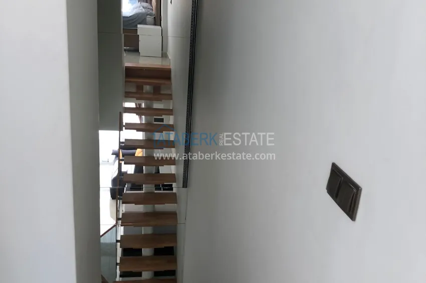 Приобрести Дуплекс в Махмутларе с боковым видом на море на первой береговой линии 6 