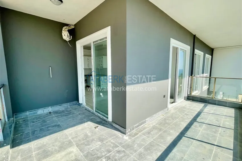 Приобрести Квартира в Алании район Инджекум с чистовой отделкой в стильной резиденции таунхаусов 7 