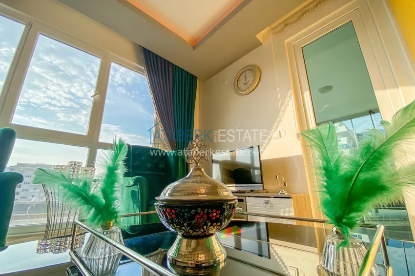 Приобрести Квартира в Махмутларе с новой мебелью и застекленным балконом в комплексе комфорт-класса 7 