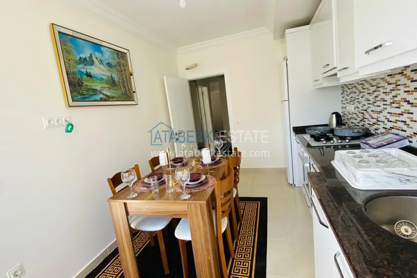 Приобрести Квартира в Махмутларе меблированная с отдельной кухней и видом на горы располагает собственной охраняемой территорией с инфраструктурой 9 