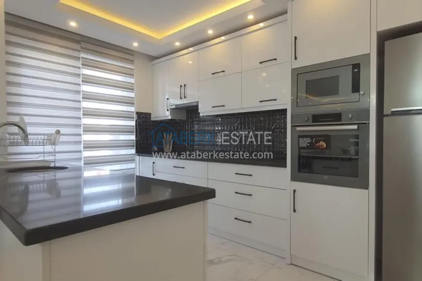 Приобрести Квартира в центре Алании - район пляжа Клеопатра, с современной мебелью и видом на горы  8 