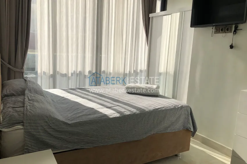 Приобрести Дуплекс в Махмутларе с боковым видом на море на первой береговой линии 8 