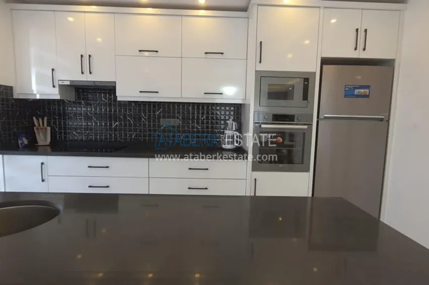 Приобрести Квартира в центре Алании - район пляжа Клеопатра, с современной мебелью и видом на горы  9 