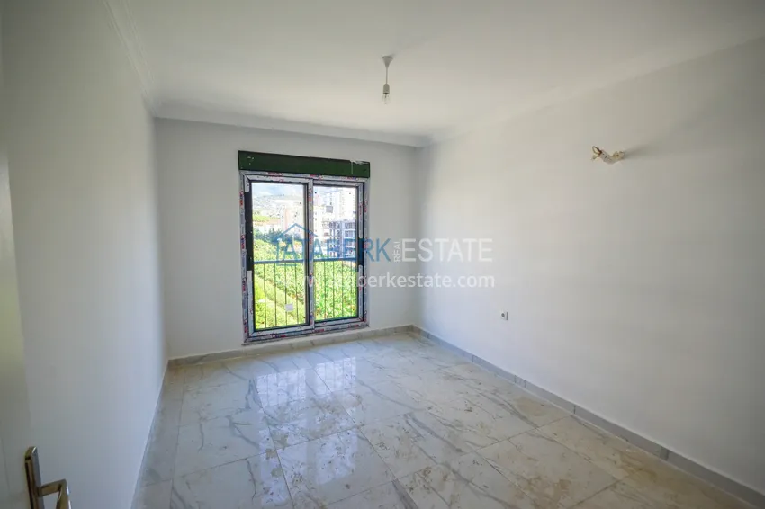 Приобрести Квартира в Махмутларе с видом на горы в современном жилом комплексе 7 