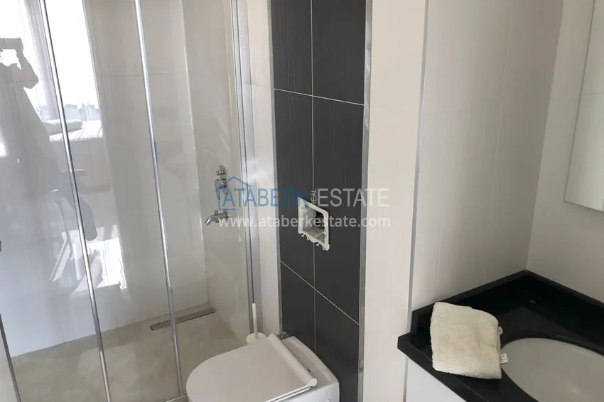 Приобрести Дуплекс в Махмутларе с боковым видом на море на первой береговой линии 9 