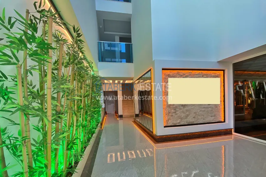 Квартира в Махмутларе меблированная с отдельной кухней и видом на горы располагает собственной охраняемой территорией с инфраструктурой 12 