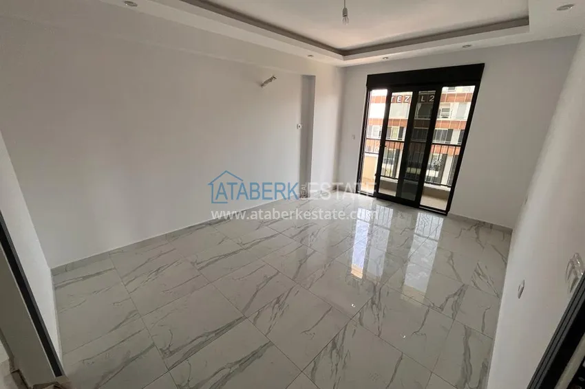 Приобрести Квартира в Махмутларе с видом на горы в современном жилом комплексе 8 