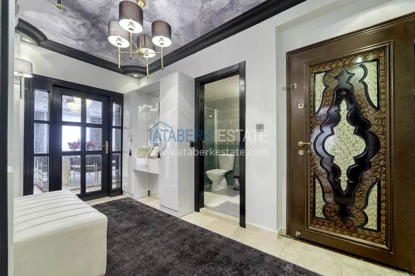 Приобрести Квартира в Махмутларе с оригинальным дизайнерским интерьером и прямым видом на море 1