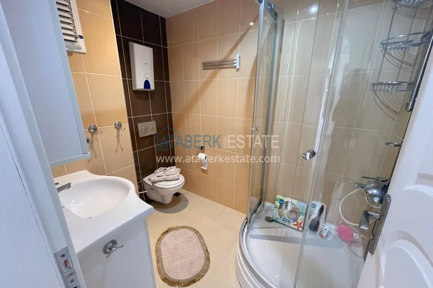 Приобрести Квартира двухкомнатная с мебелью в комплексе рядом с морем в Махмутларе 10