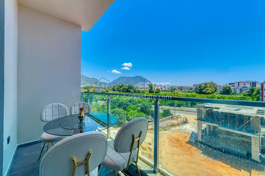 Приобрести Квартира в районе Оба двухкомнатная с новой мебелью и видом на горы 9 