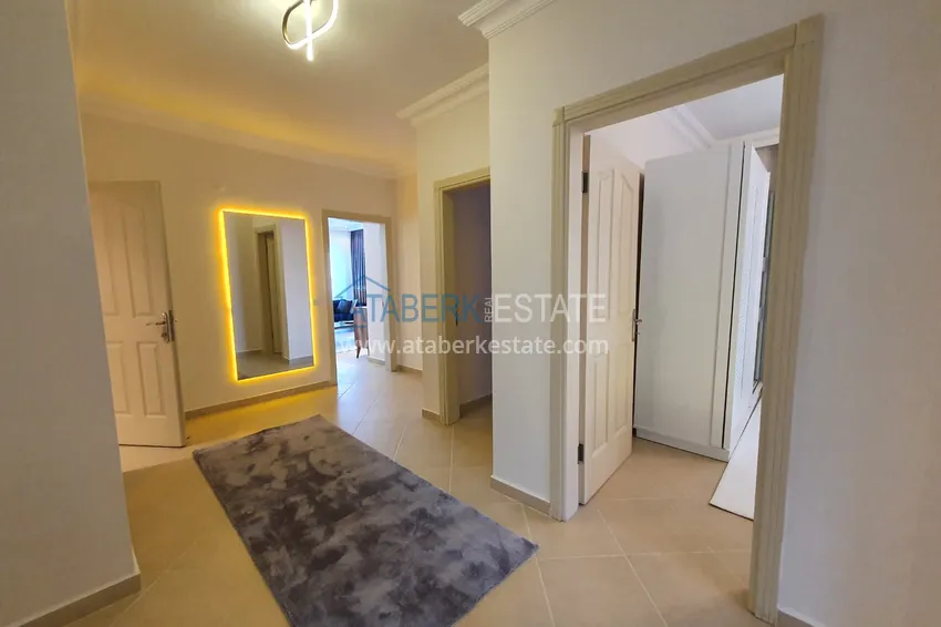 Приобрести Квартира с выходом в сад в Махмутларе трехкомнатная с новой мебелью 1 