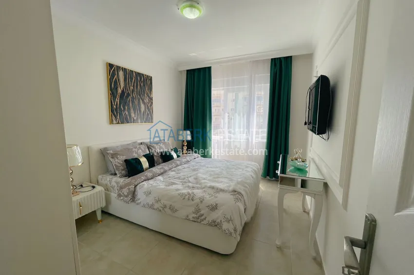 Приобрести Квартира двухкомнатная с мебелью в комплексе рядом с морем в Махмутларе 3