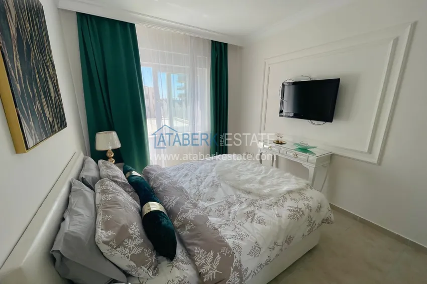 Приобрести Квартира двухкомнатная с мебелью в комплексе рядом с морем в Махмутларе 4