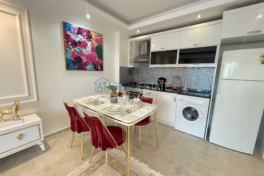 Приобрести Квартира двухкомнатная с мебелью в комплексе рядом с морем в Махмутларе 9