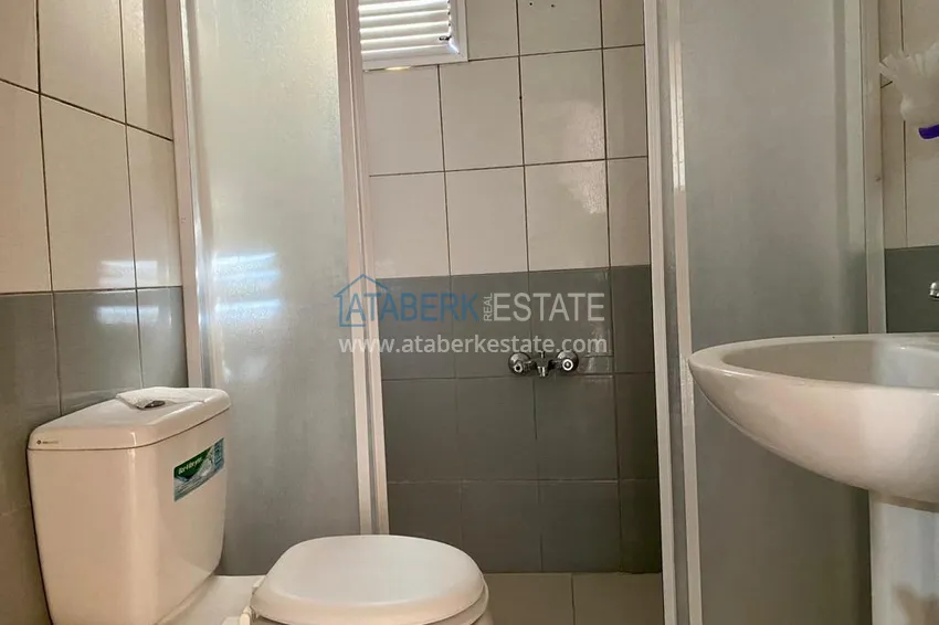 Приобрести Линейная квартира с 3 спальнями и боковым видом на море в районе Оба 11 