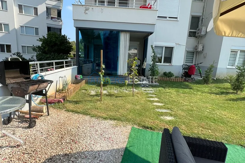 Приобрести Меблированная квартира с выходом в сад и видом на горы в Алании, район Оба в уютном жилом комплексе 11 