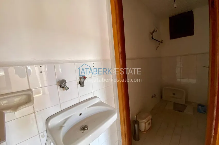 Приобрести Линейная квартира с 3 спальнями и боковым видом на море в районе Оба 12 