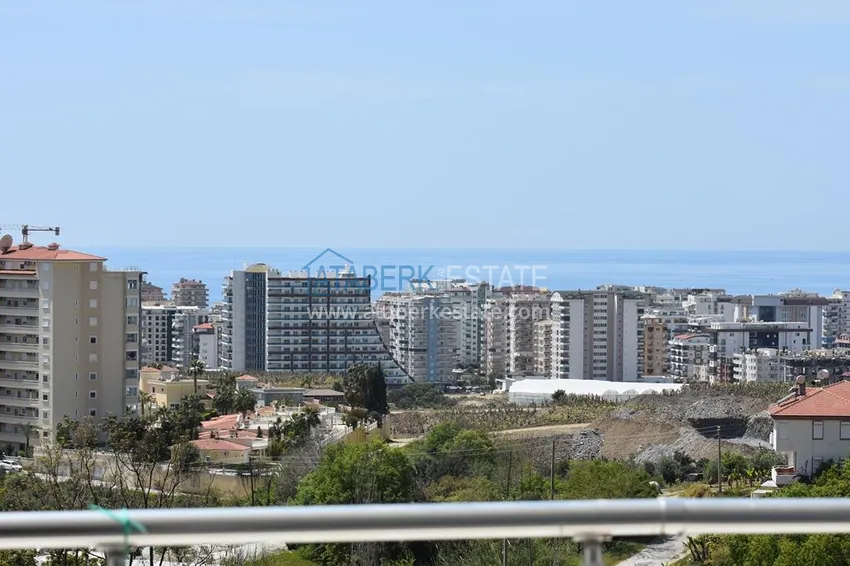 Приобрести Видовые апартаменты с 2 спальнями в районе Махмутлар в благоустроенном комплексе 15 