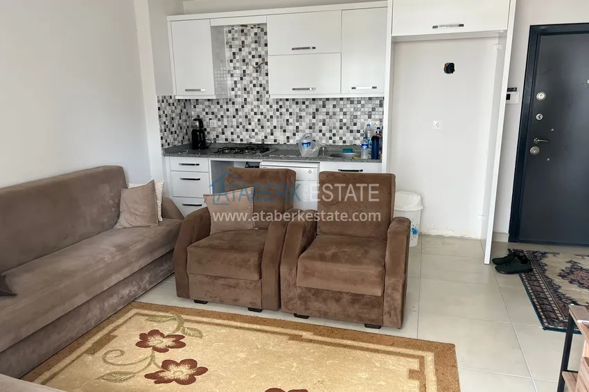 Приобрести Двухкомнатная квартира в Алании - район Оба в жилом доме городского типа 1 