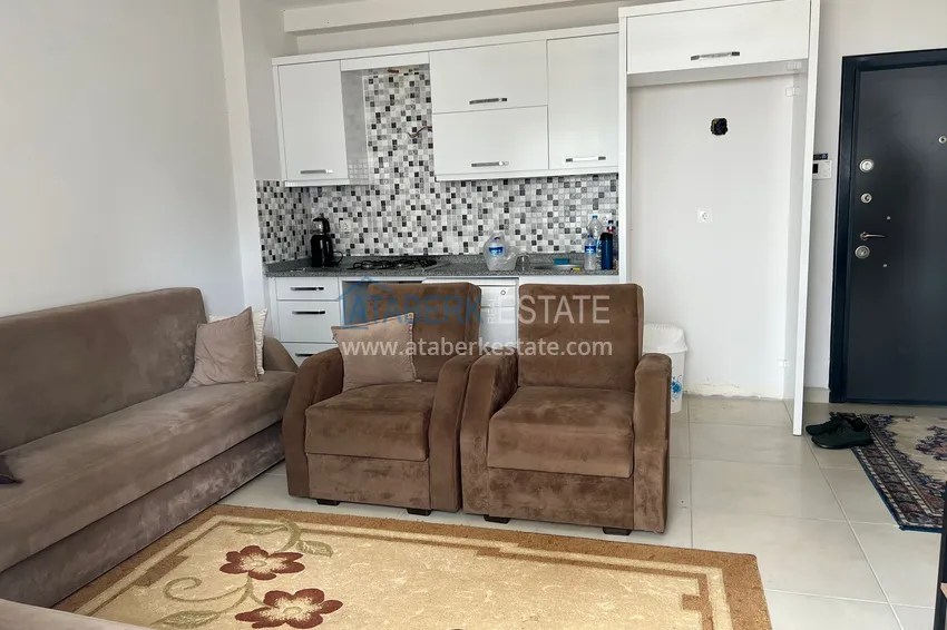 Приобрести Двухкомнатная квартира в Алании - район Оба в жилом доме городского типа 2 