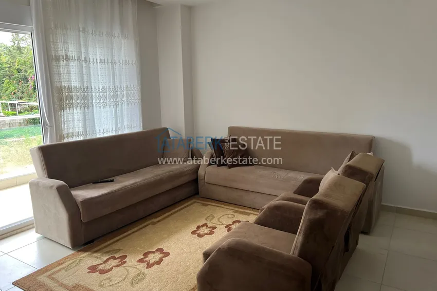 Приобрести Двухкомнатная квартира в Алании - район Оба в жилом доме городского типа 3 