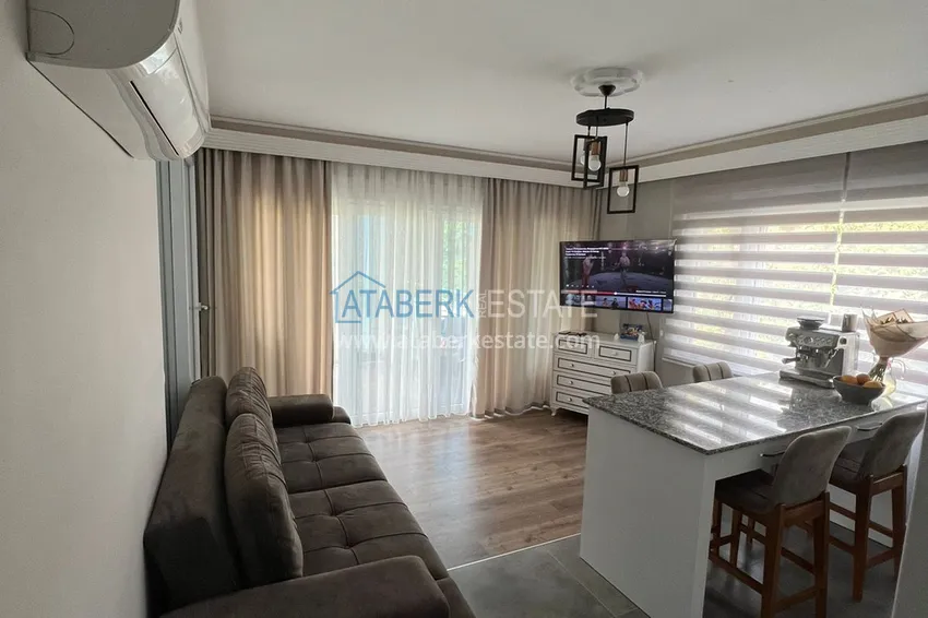 Приобрести Меблированная квартира с выходом в сад и видом на горы в Алании, район Оба в уютном жилом комплексе 3 