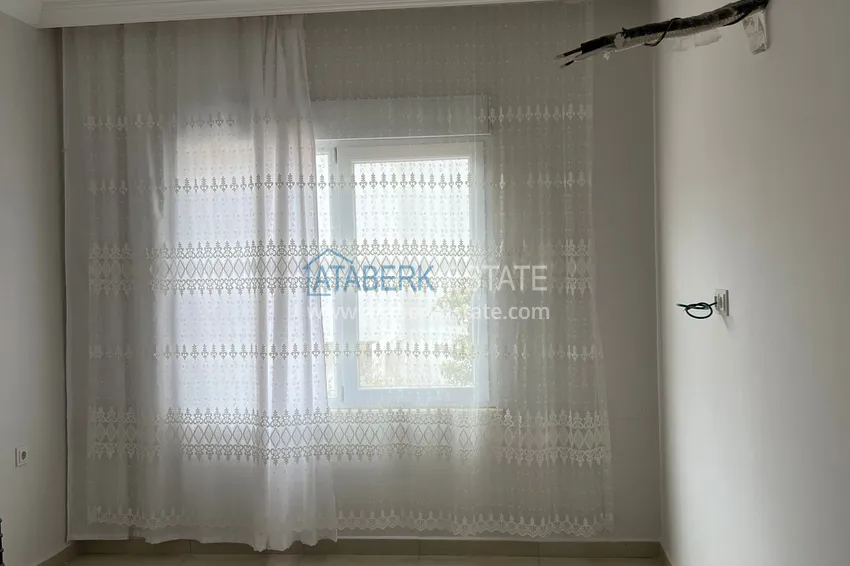 Приобрести Двухкомнатная квартира в Алании - район Оба в жилом доме городского типа 5 