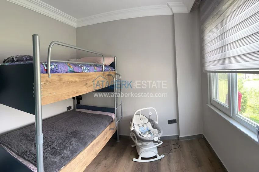 Приобрести Меблированная квартира с выходом в сад и видом на горы в Алании, район Оба в уютном жилом комплексе 6 