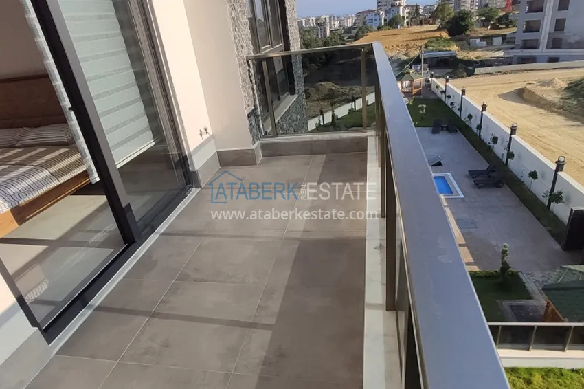 Приобрести Двухкомнатная квартира с новой мебелью в Алании район Авсаллар - Новостройка 7 