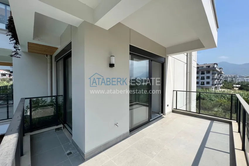 Приобрести Квартира в Алании район Оба с чистовой отделкой и видом на горы 10 