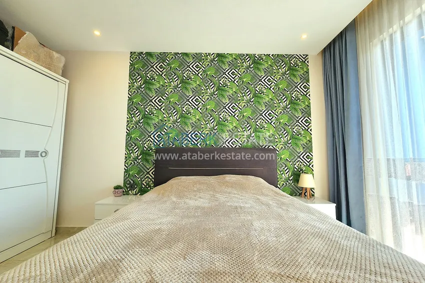 Приобрести Двухкомнатная меблированная квартира с видом на горы в Алании, районе пляжа Клеопатра 11 