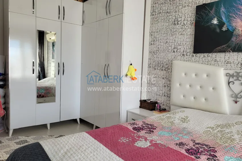 Приобрести Квартира с выходом в сад и застеклённым балконом в Оба в уютном жилом комплексе 10 