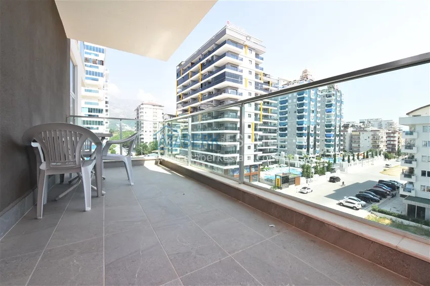 Приобрести Квартира в Махмутларе меблированная с видом на горы в комплексе комфорт-класса 11 