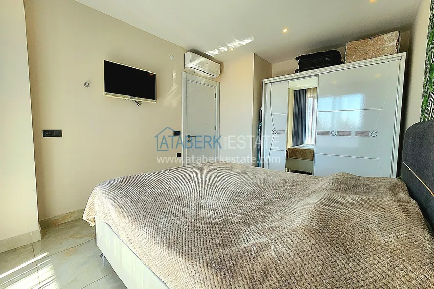 Приобрести Двухкомнатная меблированная квартира с видом на горы в Алании, районе пляжа Клеопатра 12 