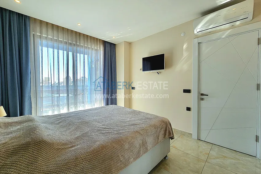 Приобрести Двухкомнатная меблированная квартира с видом на горы в Алании, районе пляжа Клеопатра 13 